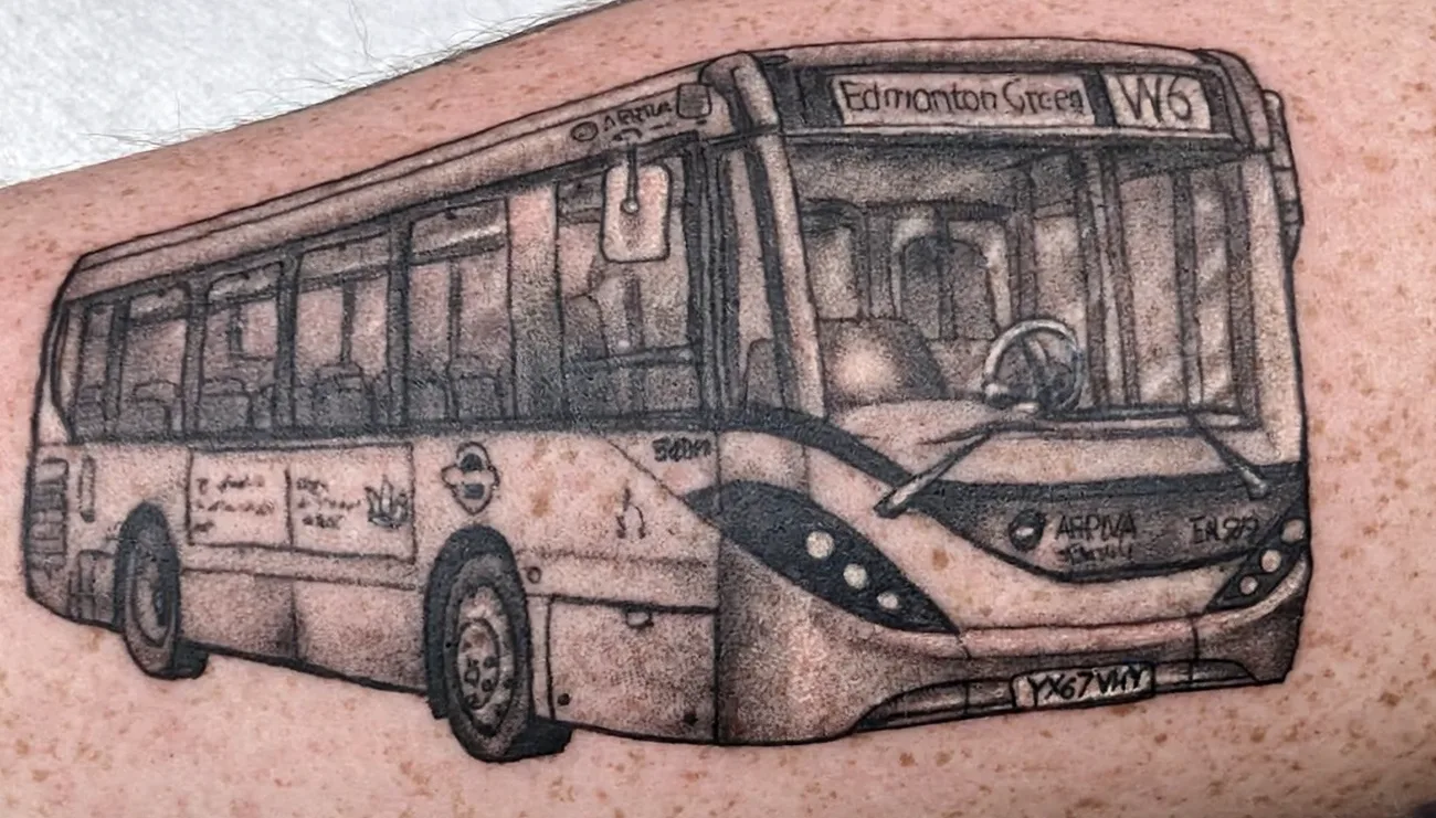 Black and grey realism tattoo of an Arriva Edmonton Green W6 London bus with fine detail and shading by Ivan Todorov at N9 Tattoo, Edmonton, North London