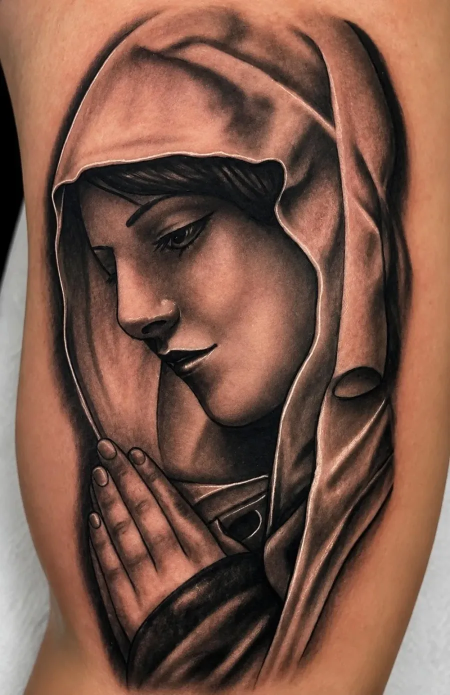 Black and grey Madonna portrait tattoo by Ivan Todorov at N9 Tattoo, Edmonton