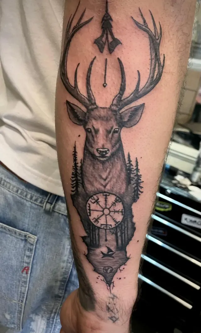 Black and grey stag with forest and Norse compass forearm tattoo, N9 Tattoo, Edmonton, North London